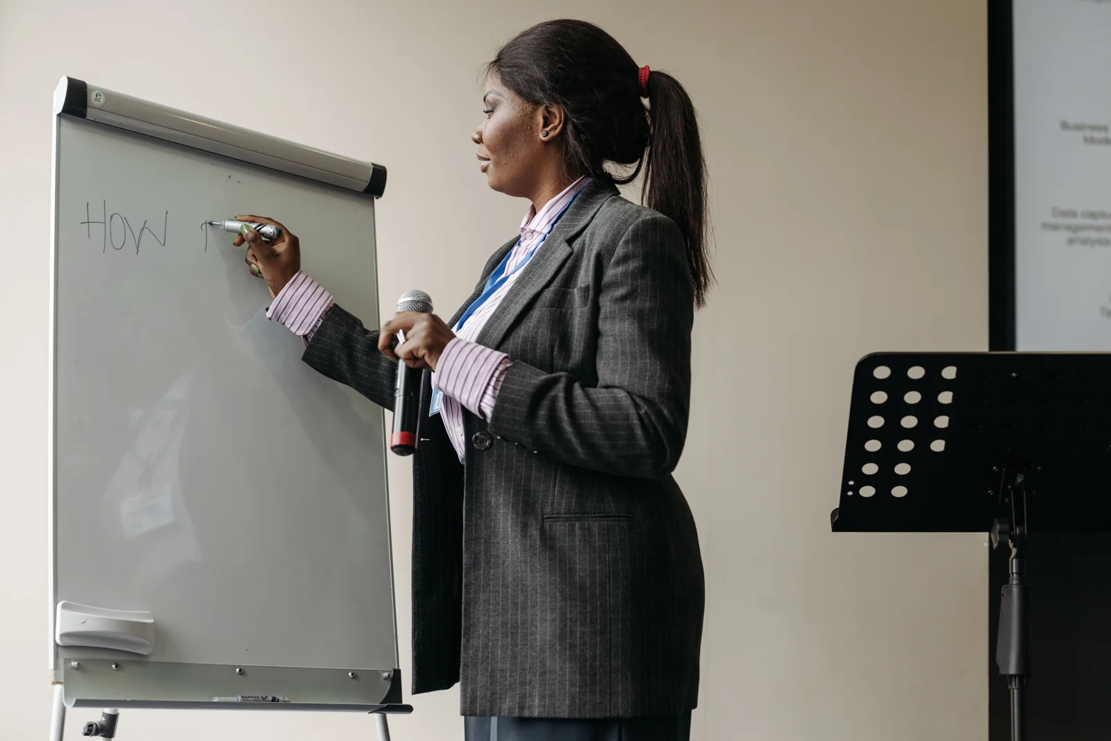 Training session with a facilitator in front of a whiteboard